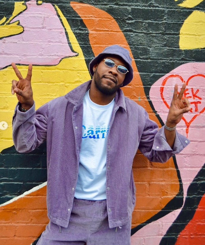 AFTRPRTY wearing a purple bucket hat and sunglasses